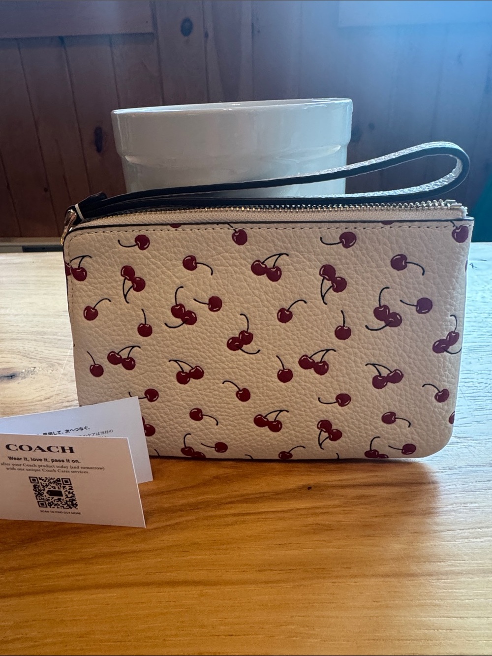 Coach Cream Pebble Leather Wristlet with Red Cherry Print - Picture 2 of 3
